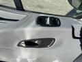 Interior door handle of a 2017 Ford Transit-350 with a gray plastic finish and a sleek design