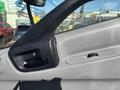 Interior view of a 2018 Hino 195 showing the driver's side door handle and window control buttons
