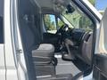 Interior view of a 2022 RAM Promaster 350 showcasing two front seats with a steering wheel and dashboard elements visible