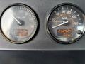 Two circular gauges displaying engine RPM and speedometer readings on a 2020 Peterbilt 330 dashboard with digital metrics