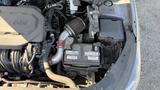 The image shows the engine compartment of a 2018 Hyundai Sonata featuring an exposed air filter and visible battery alongside various engine components