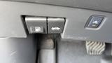 Interior controls of a 2019 Nissan Kicks featuring buttons for fuel release and trunk opening