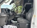 A 2020 Ford Transit 250 interior showing the driver's side with a steering wheel and driver seat visible