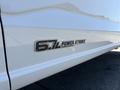 Close-up of a 2023 Ford F-350 SD badge displaying 6.7L Power Stroke Turbo Diesel