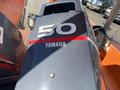 A close-up view of a Yamaha outboard motor with a 50 horsepower label on a 2007 Fassmer 20 Foot Fast Rescue Boat