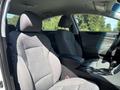 Interior view of a 2015 Hyundai Sonata highlighting grey fabric seats and a central console