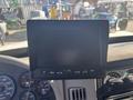 A dashboard display monitor for a 2008 International 4400 truck featuring control buttons and a blank screen