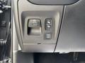 Control panel of a 2021 RAM 1500 featuring buttons for parking brake and power outlets
