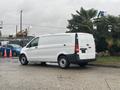 A 2021 Mercedes-Benz Metris van in white with a sliding door and standard cargo van design parked at an outdoor location