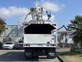 A 2019 Freightliner M2 106 truck with a white exterior and elevated work platform equipment mounted on the back