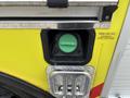 Fuel filler cap of a 2010 Ford F-550 Super Duty featuring a green cap and labeled for diesel fuel only