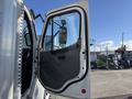 A 2012 Freightliner M2 106 truck door is open showcasing the interior panel with a handle and window. The door has a grey interior and a white exterior surface.