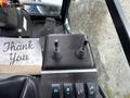Control panel of a 2019 Madvac LS175 with two joystick controls and several switches for operating the machine