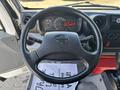 Steering wheel of a 2018 Hino 195 with dashboard display showing speed and fuel information
