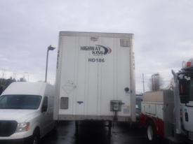 A white 2023 Wabash International trailer with "HIGHWAY KING" branding and the HD186 model number on its rear