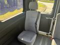 A single gray cloth seat with a seatbelt located inside a 2020 RAM ProMaster 3500 van